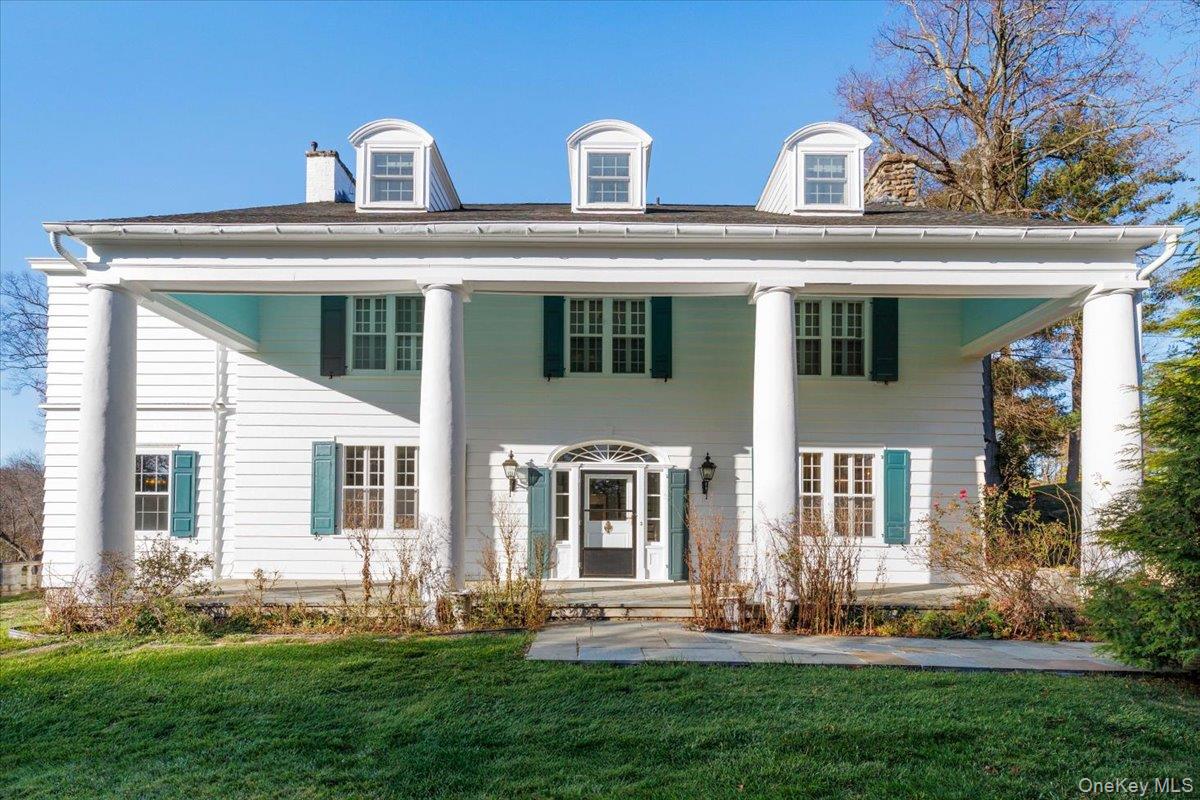 83 Somerstown Road Ossining, NY 10562 - Photo 6 of 38 a front view of a house with a yard table and chairs