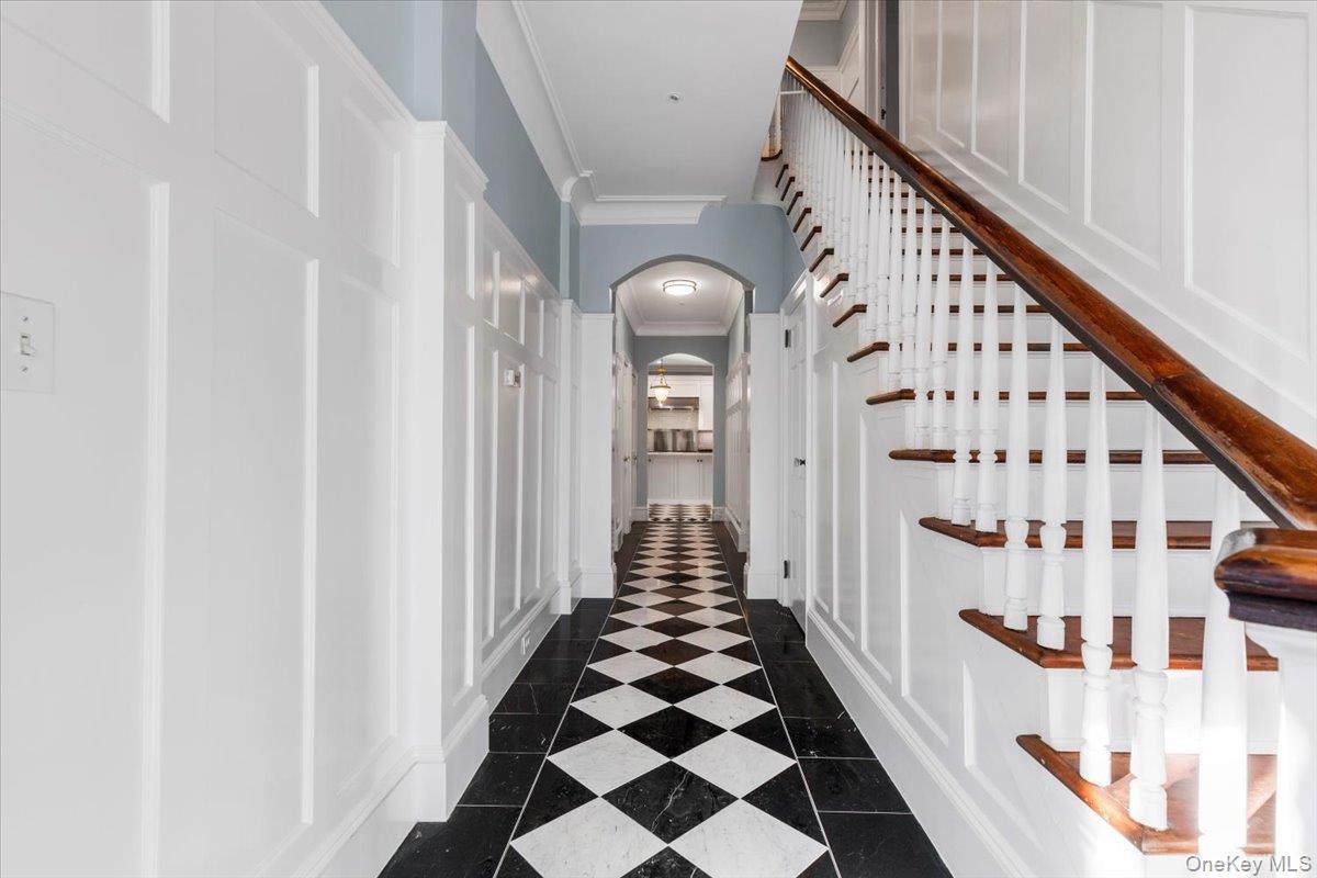 83 Somerstown Road Ossining, NY 10562 - Photo 8 of 38 a view of a hallway with wooden floor and staircase