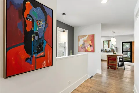 wooden floor with painting on the wall