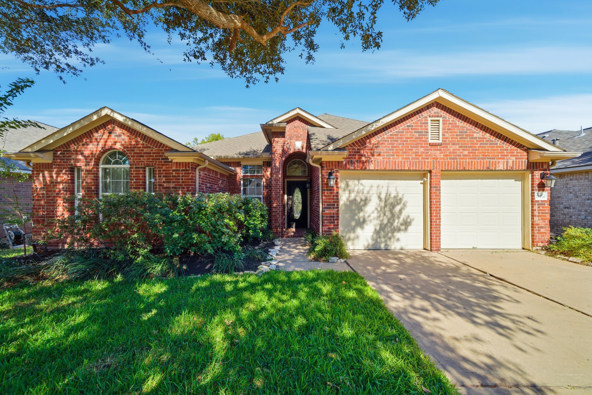17714 Sunset River Lane Houston, TX 77084 - Photo 1 of 20 a front view of a house with a yard and porch