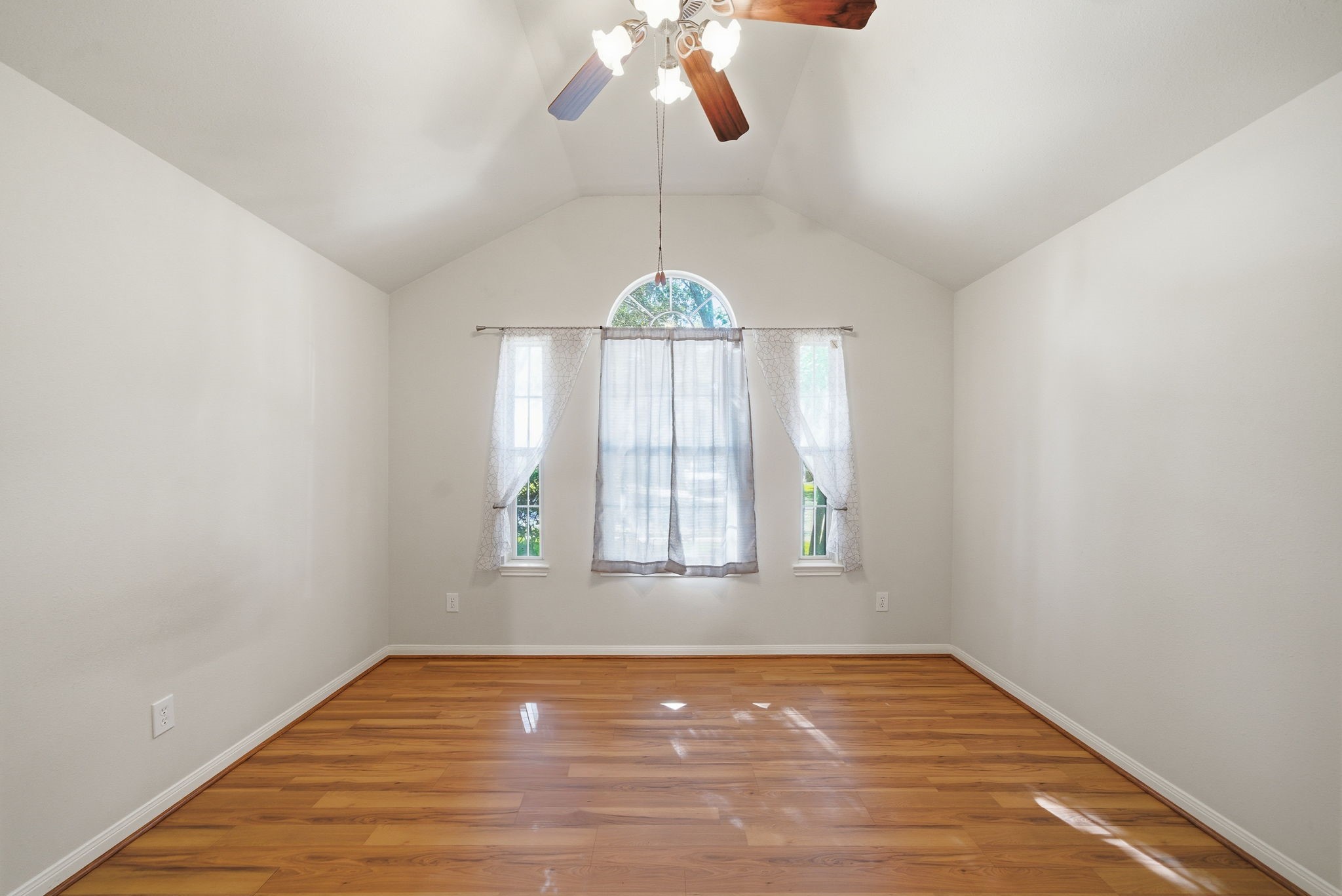 17714 Sunset River Lane Houston, TX 77084 - Photo 16 of 20 a view of an empty room with window and wooden floor