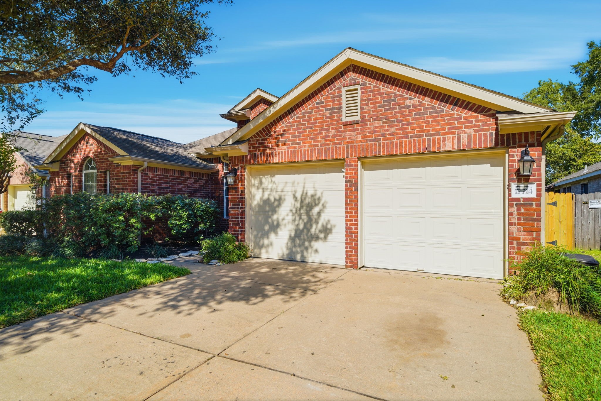 17714 Sunset River Lane Houston, TX 77084 - Photo 20 of 20 a front view of a house with a garden