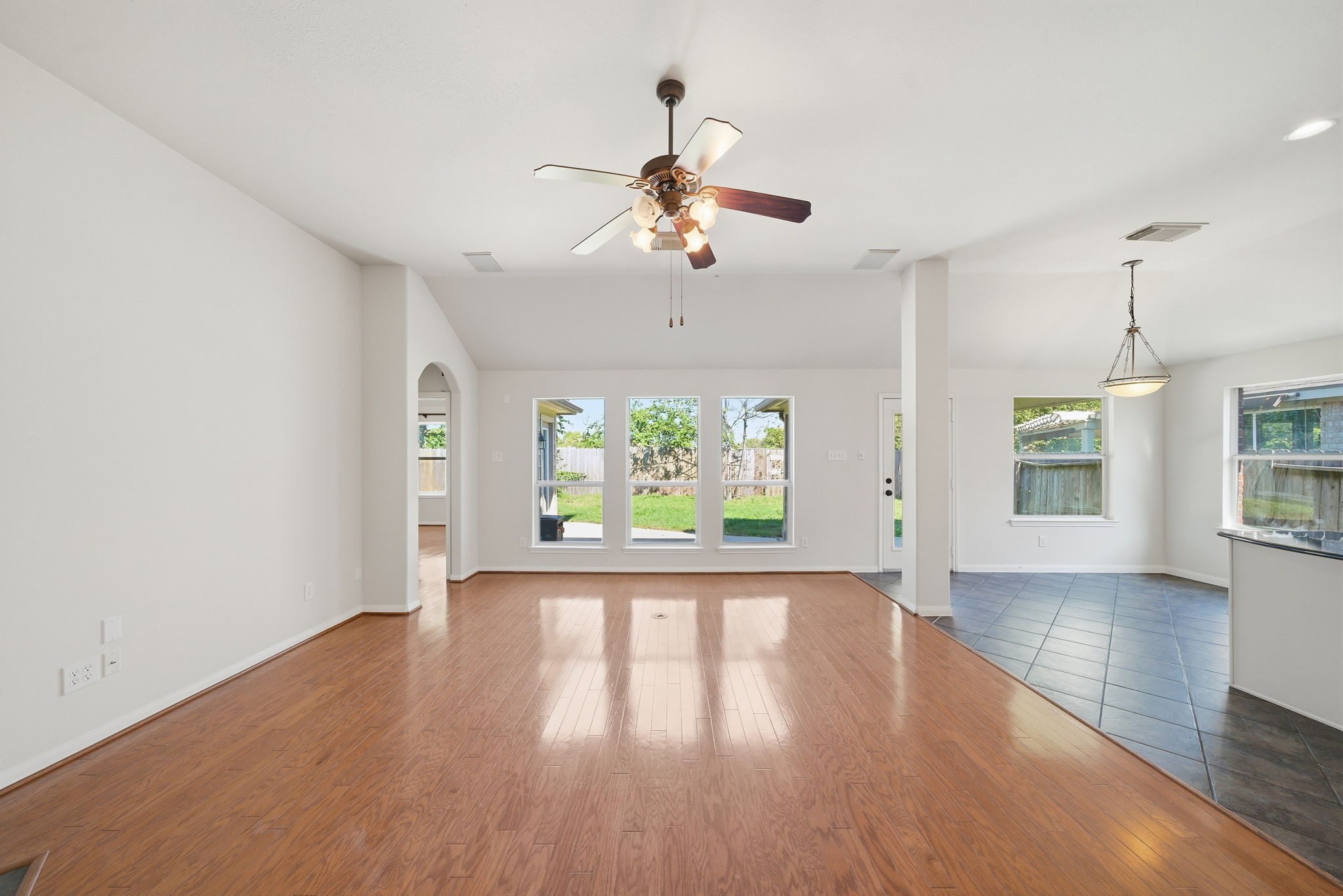 17714 Sunset River Lane Houston, TX 77084 - Photo 2 of 20 a view of an empty room with wooden floor and a window