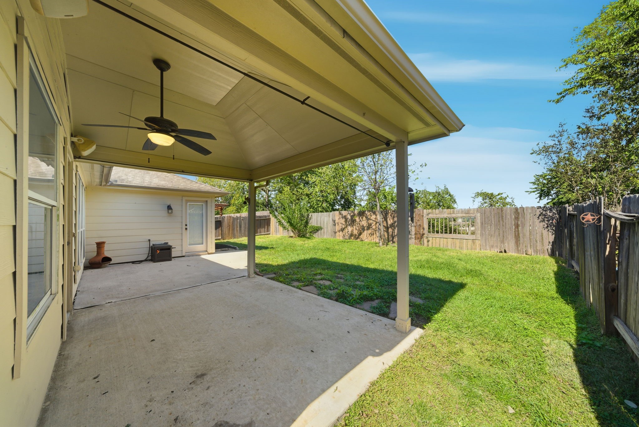 17714 Sunset River Lane Houston, TX 77084 - Photo 7 of 20 a view of a porch with furniture and garden
