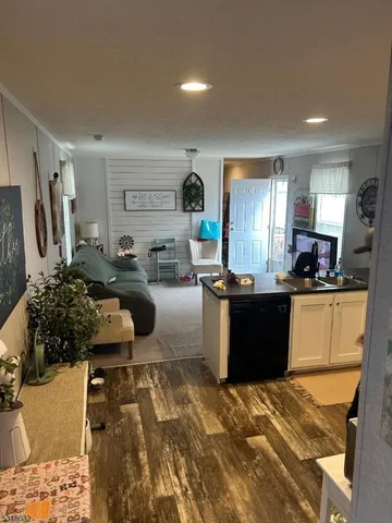 a kitchen with a refrigerator and a stove