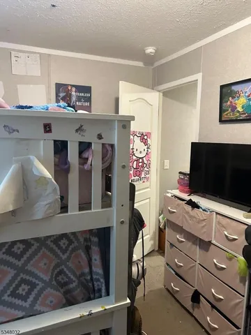a room with furniture and a flat screen tv