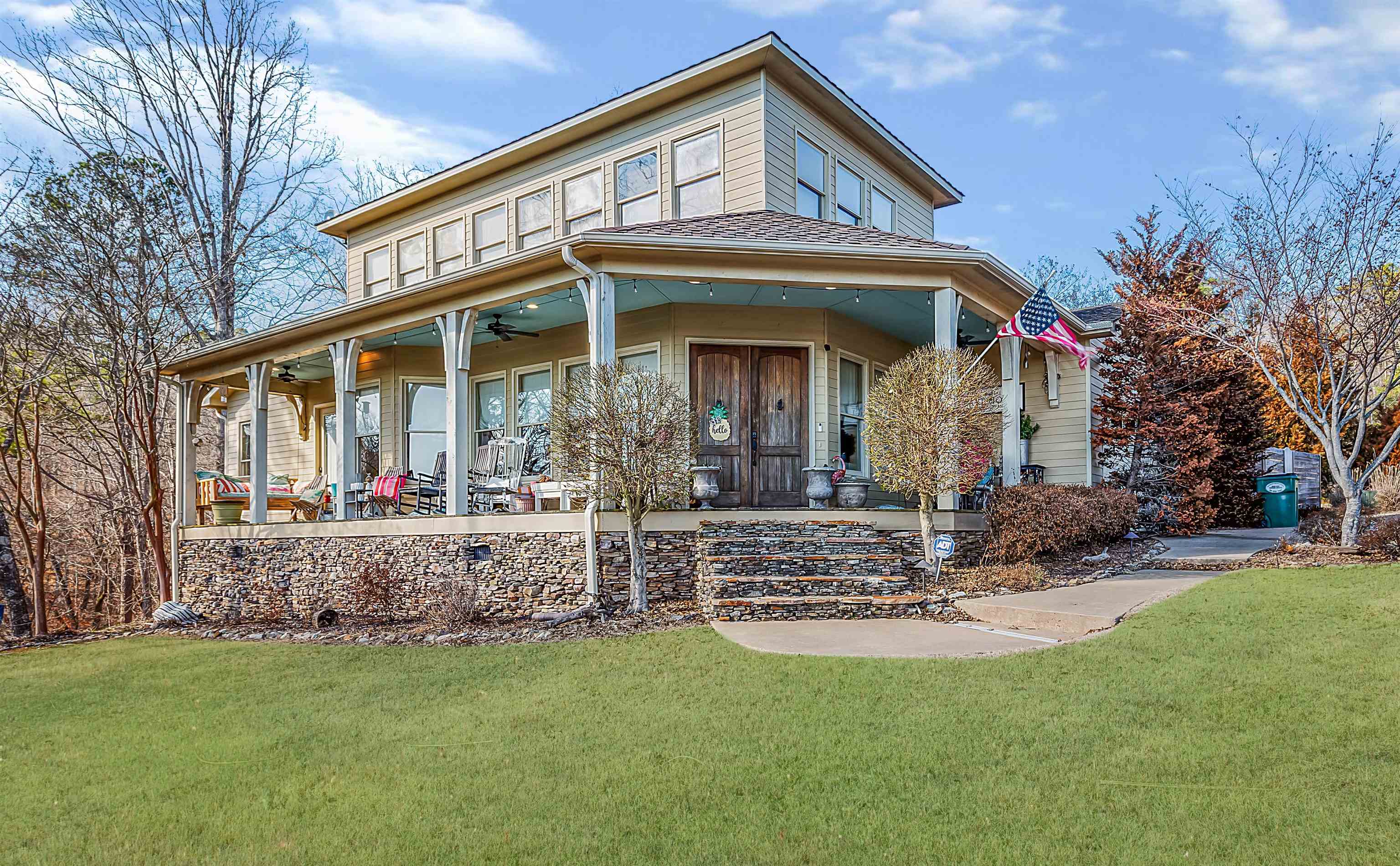 a view of a house with backyard and sitting area