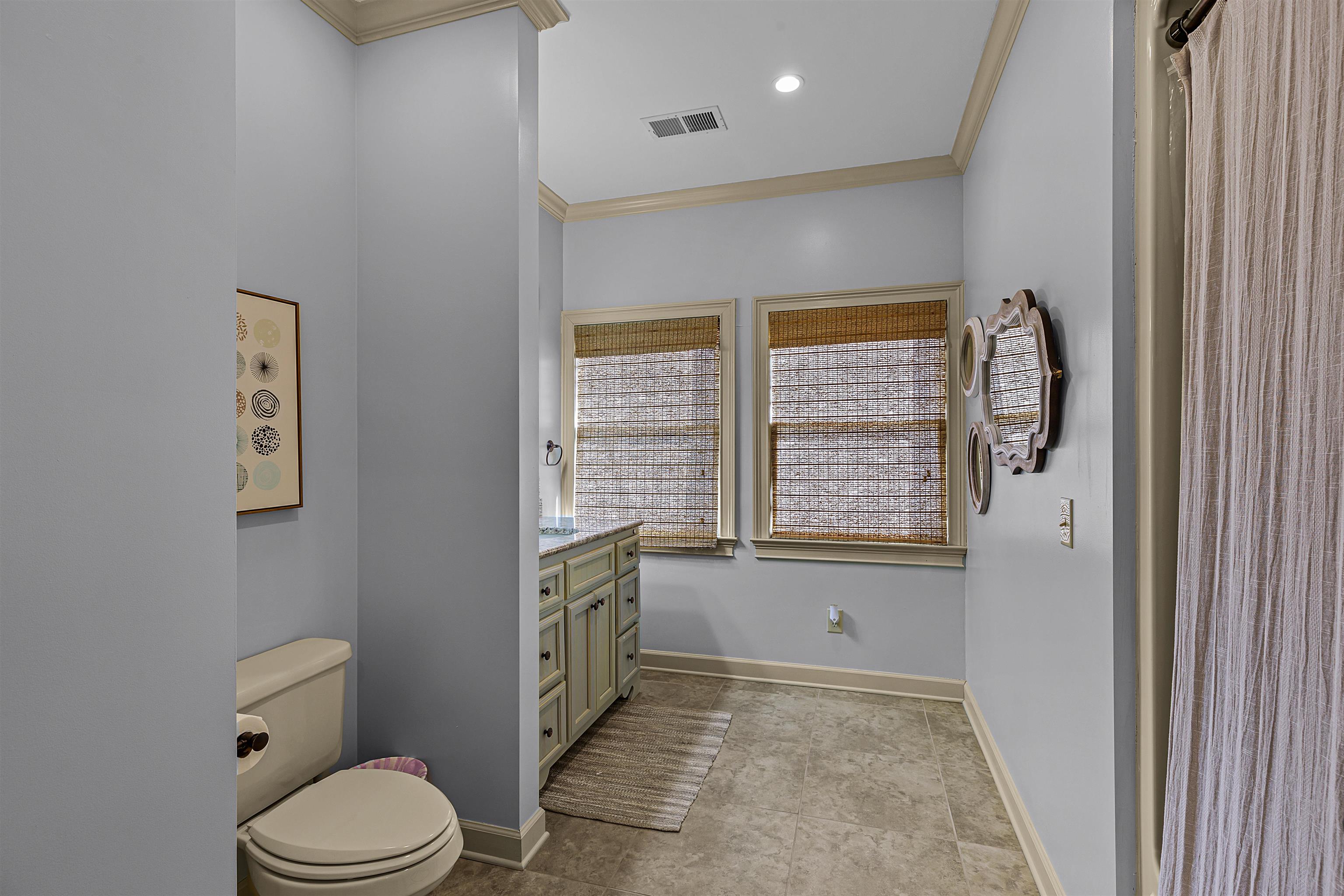 70 Light Pointe Savannah, TN 38372 - Photo 15 of 20 a bathroom with a granite countertop toilet a sink and a mirror