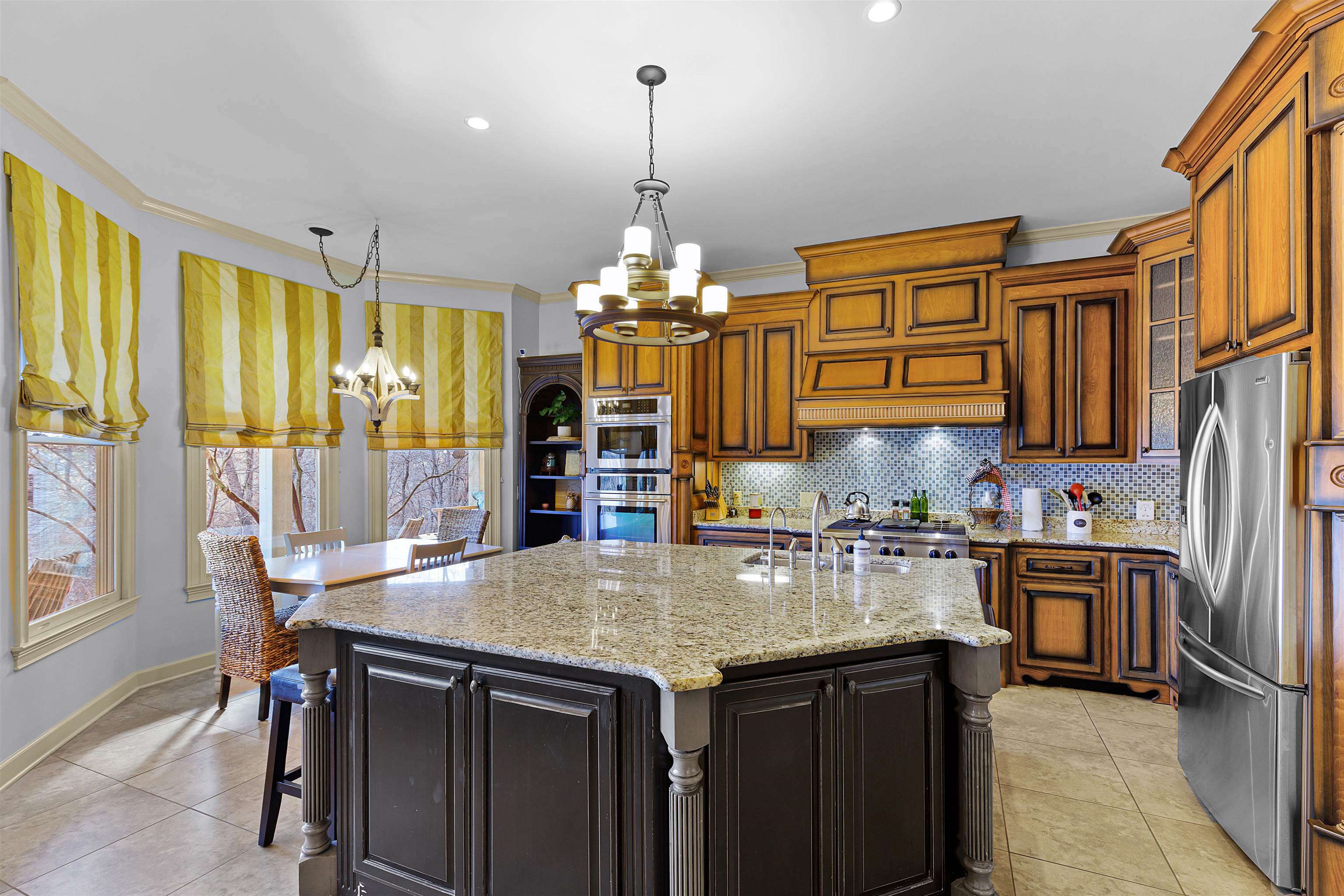 70 Light Pointe Savannah, TN 38372 - Photo 7 of 20 a kitchen with stainless steel appliances granite countertop a stove and a refrigerator