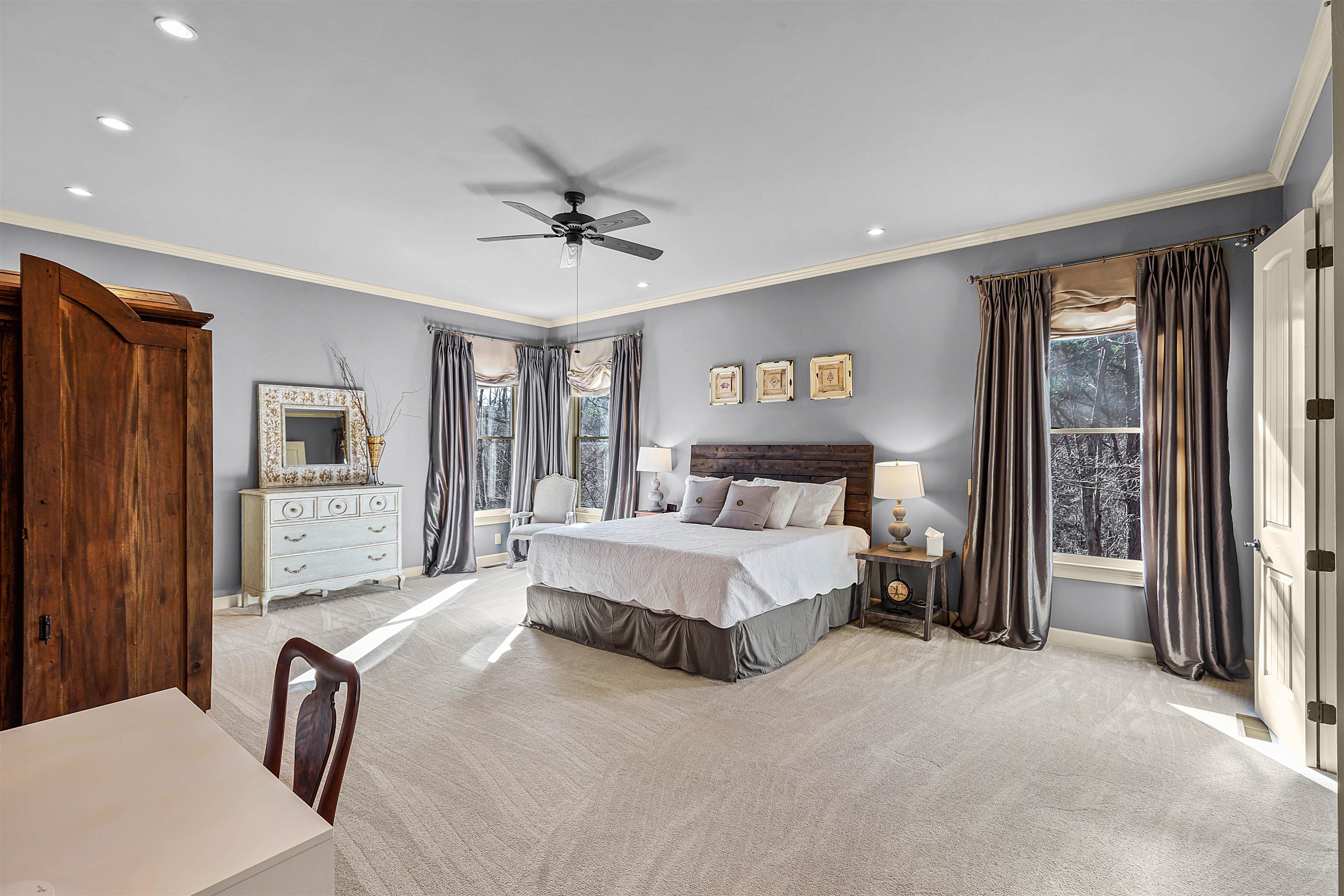 70 Light Pointe Savannah, TN 38372 - Photo 10 of 20 a spacious bedroom with a large bed and a chandelier