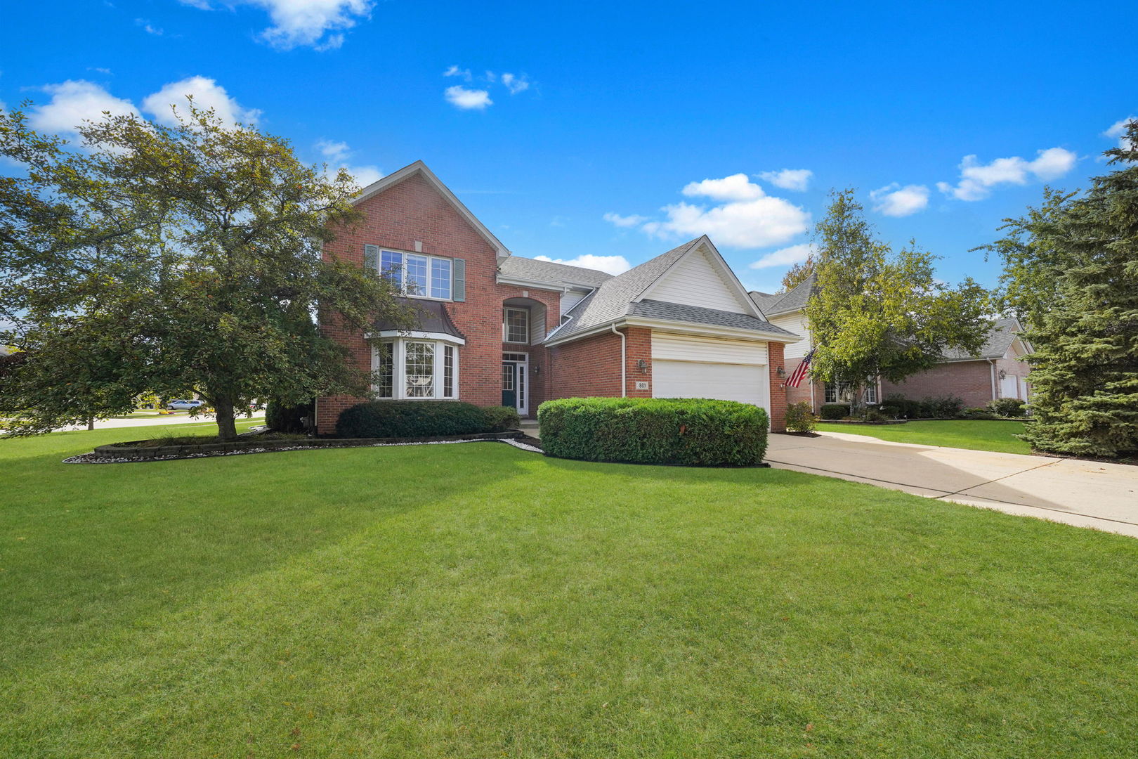 801 West Veterans Parkway Addison, IL 60101 - Photo 2 of 42 a front view of a house with a yard and trees