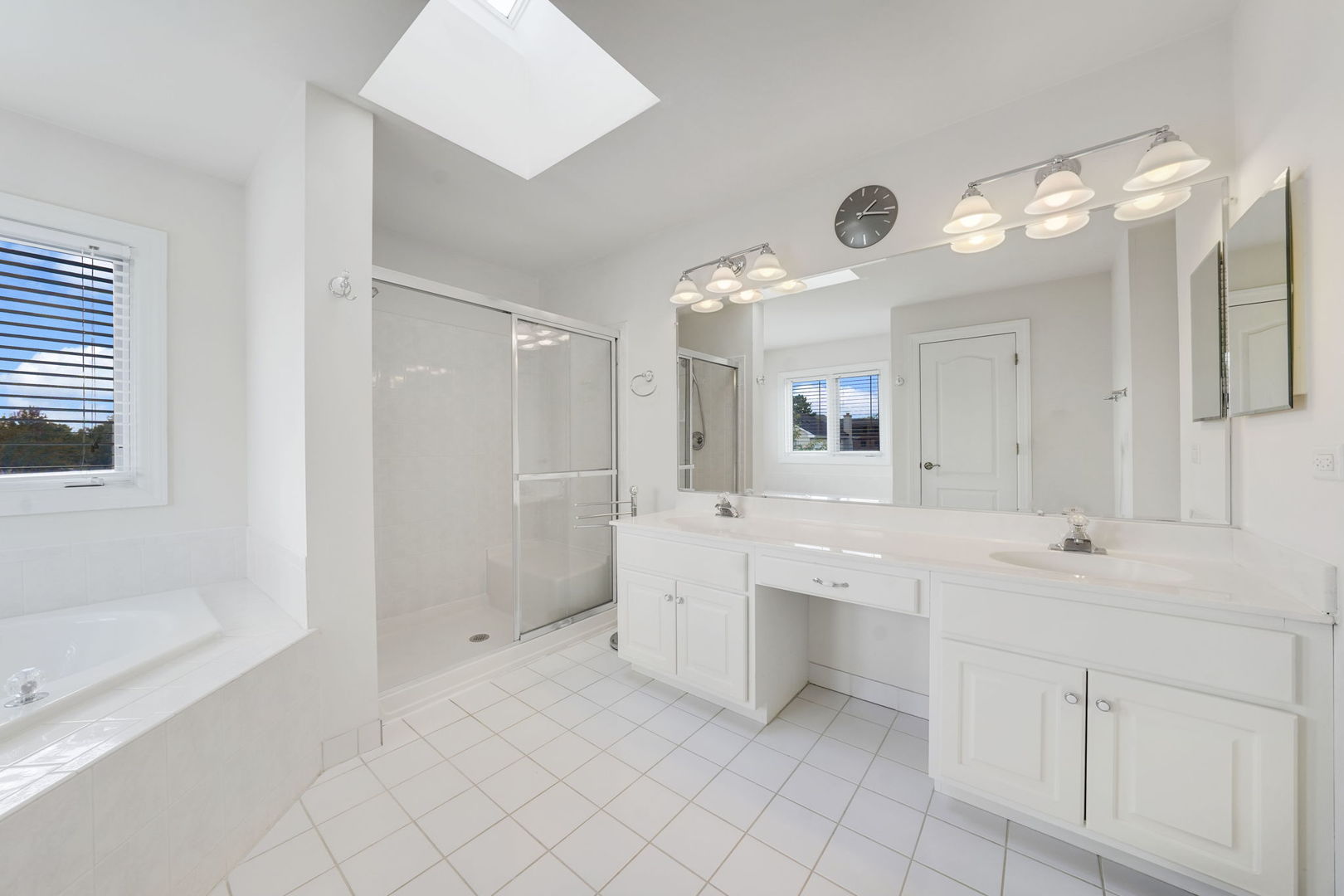801 West Veterans Parkway Addison, IL 60101 - Photo 25 of 42 a spacious bathroom with a double vanity sink mirror and bathtub