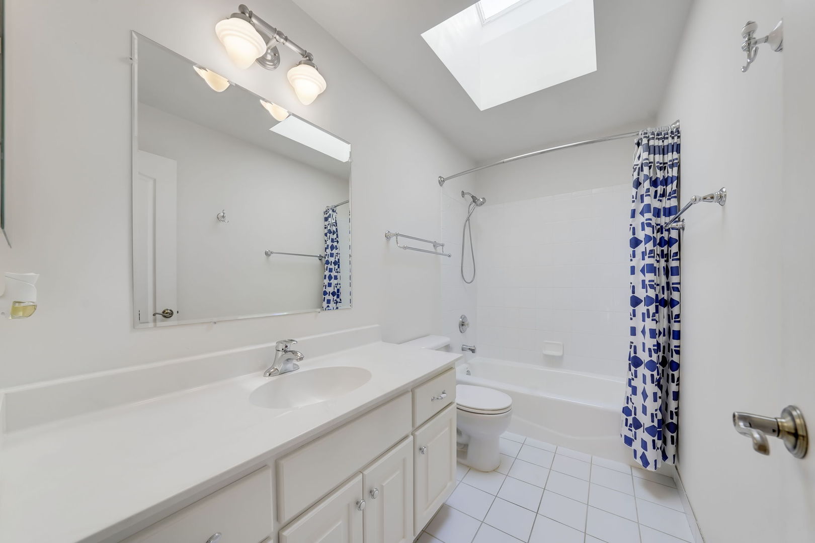 801 West Veterans Parkway Addison, IL 60101 - Photo 29 of 42 a bathroom with a sink a toilet a shower and a mirror