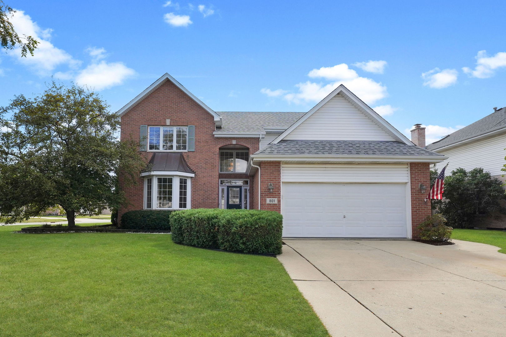 801 West Veterans Parkway Addison, IL 60101 - Photo 42 of 42 a front view of a house with a yard and garage