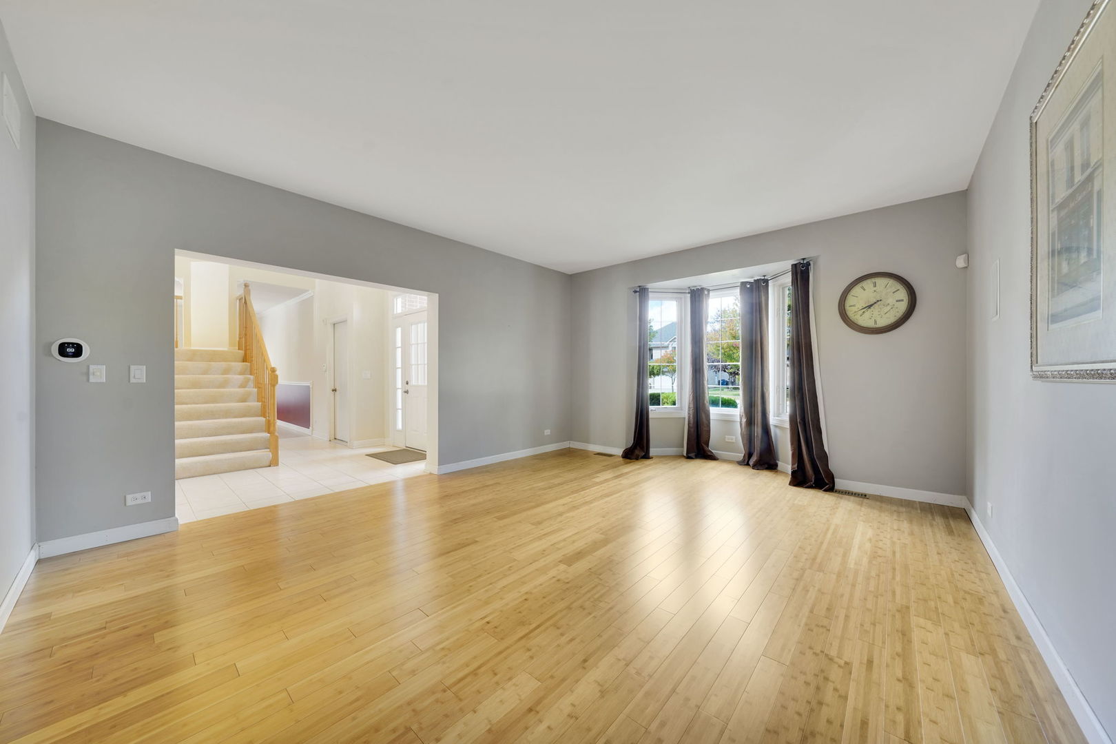 801 West Veterans Parkway Addison, IL 60101 - Photo 5 of 42 a view of an empty room with wooden floor and window