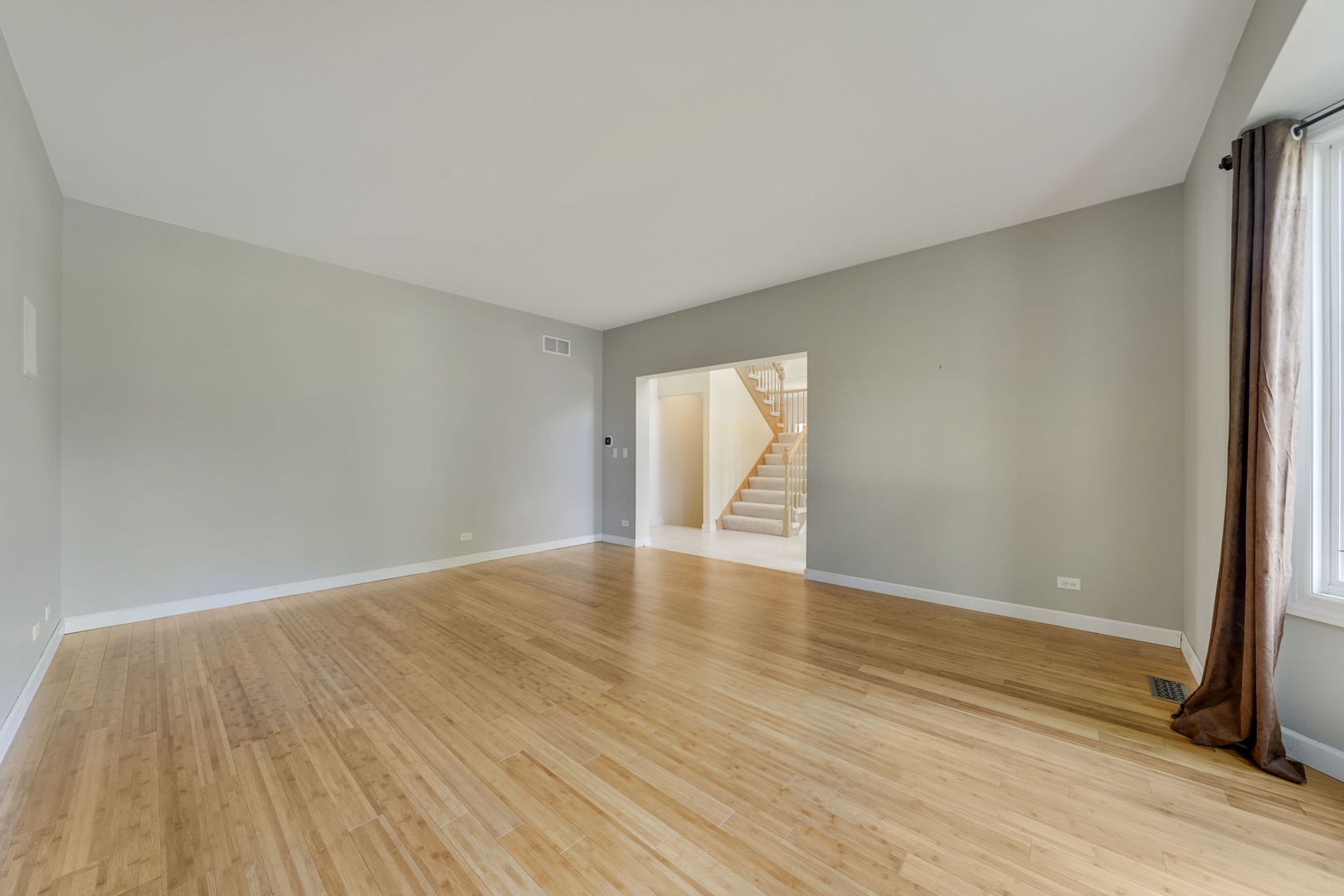 801 West Veterans Parkway Addison, IL 60101 - Photo 6 of 42 a view of empty room with wooden floor and fan