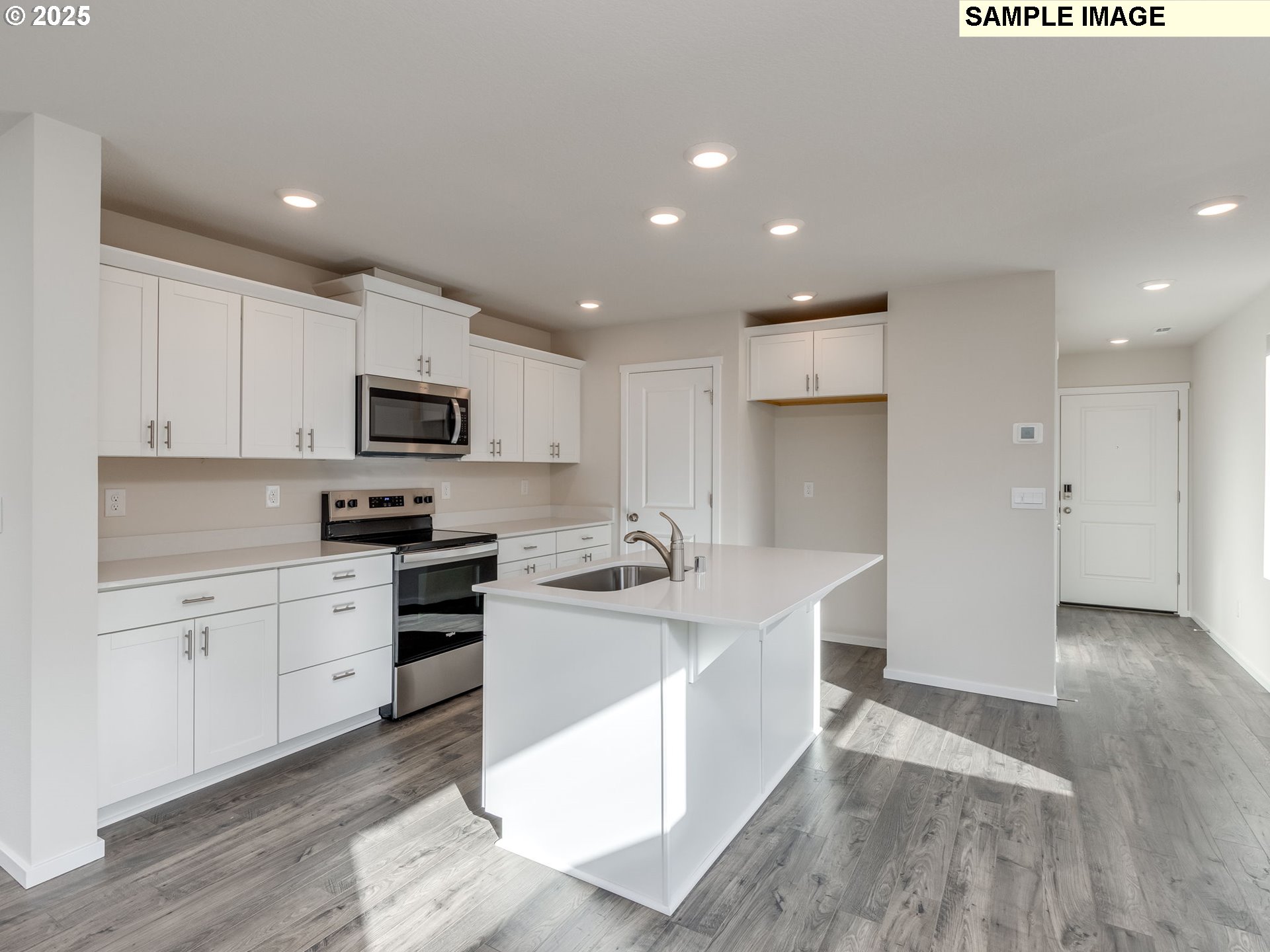 19308 Southeast 11th Way Camas, WA 98607 - Photo 4 of 28 a kitchen with stainless steel appliances kitchen island granite countertop a sink and cabinets