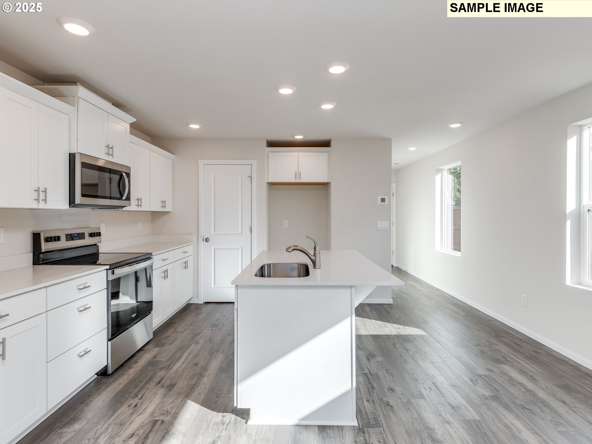 19308 Southeast 11th Way Camas, WA 98607 - Photo 5 of 28 a kitchen with a sink a counter top space stainless steel appliances and a window