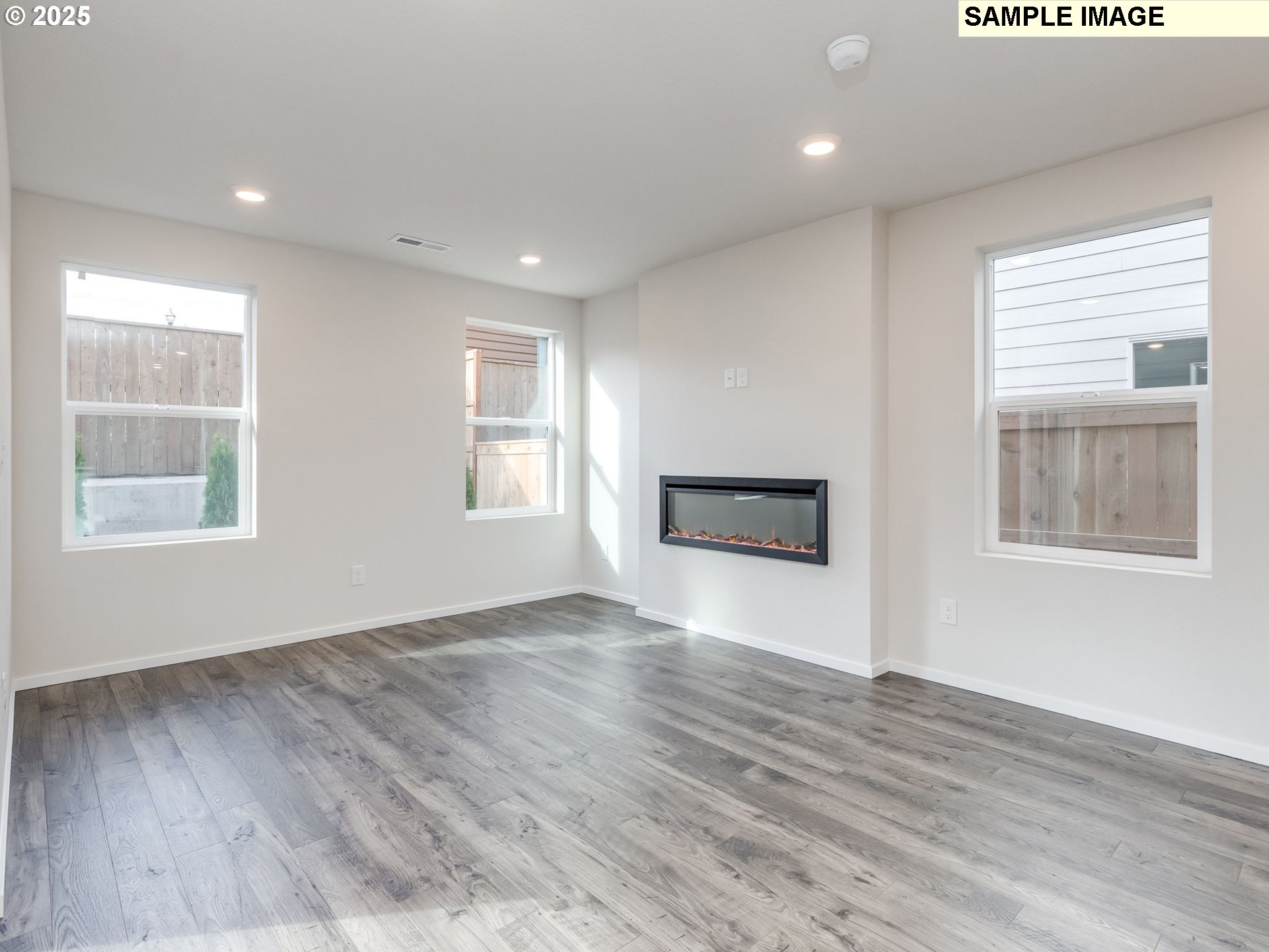 19308 Southeast 11th Way Camas, WA 98607 - Photo 9 of 28 a view of an empty room with wooden floor and a window