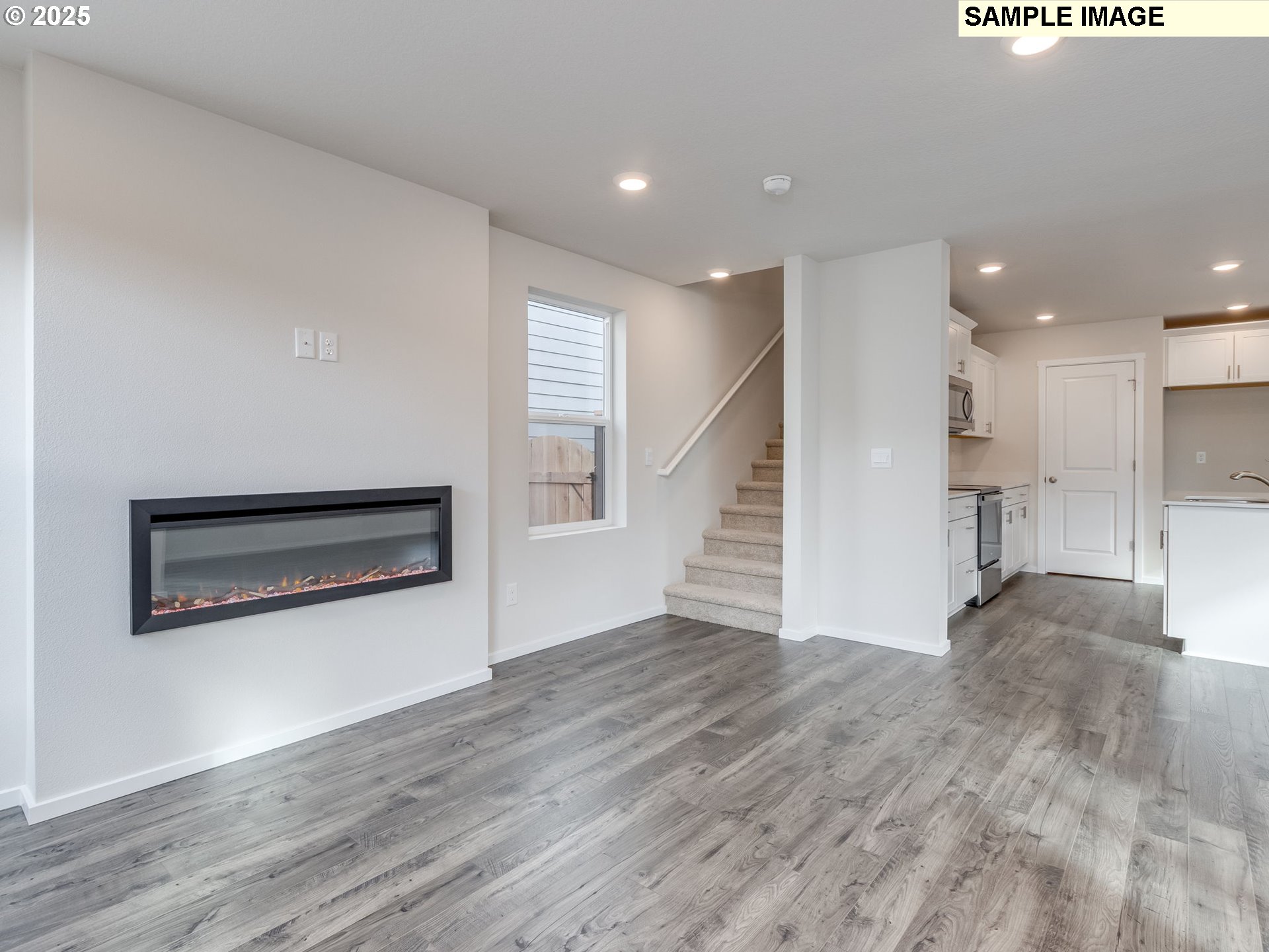19308 Southeast 11th Way Camas, WA 98607 - Photo 10 of 28 a view of a hallway with wooden floor and kitchen