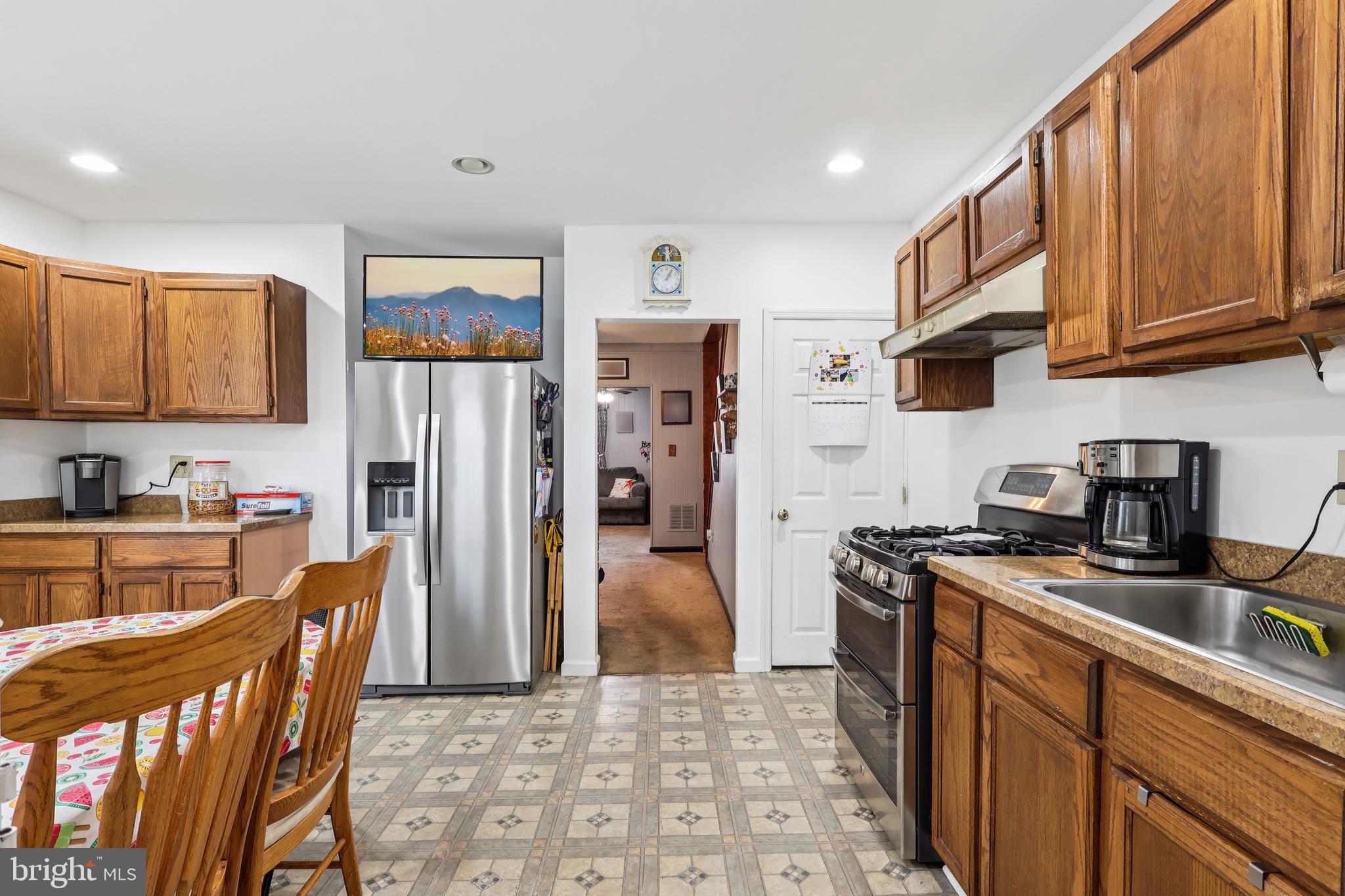 305 Filmore Street Riverside, NJ 08075 - Photo 11 of 32 a kitchen with stainless steel appliances granite countertop a refrigerator stove microwave and sink
