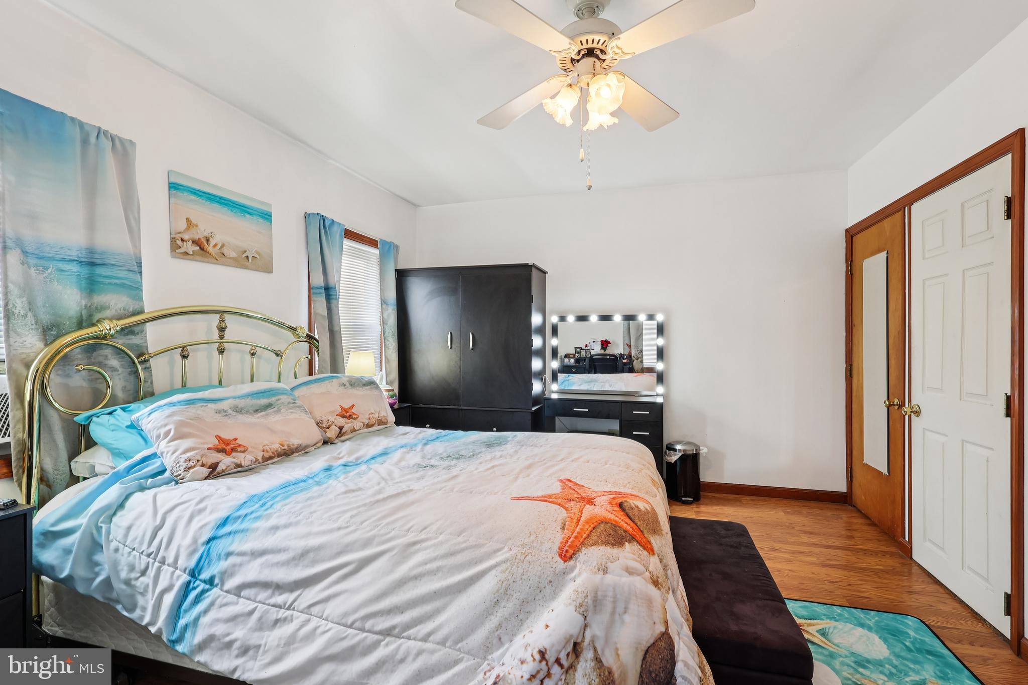 305 Filmore Street Riverside, NJ 08075 - Photo 12 of 32 a bedroom with a bed and wooden floor
