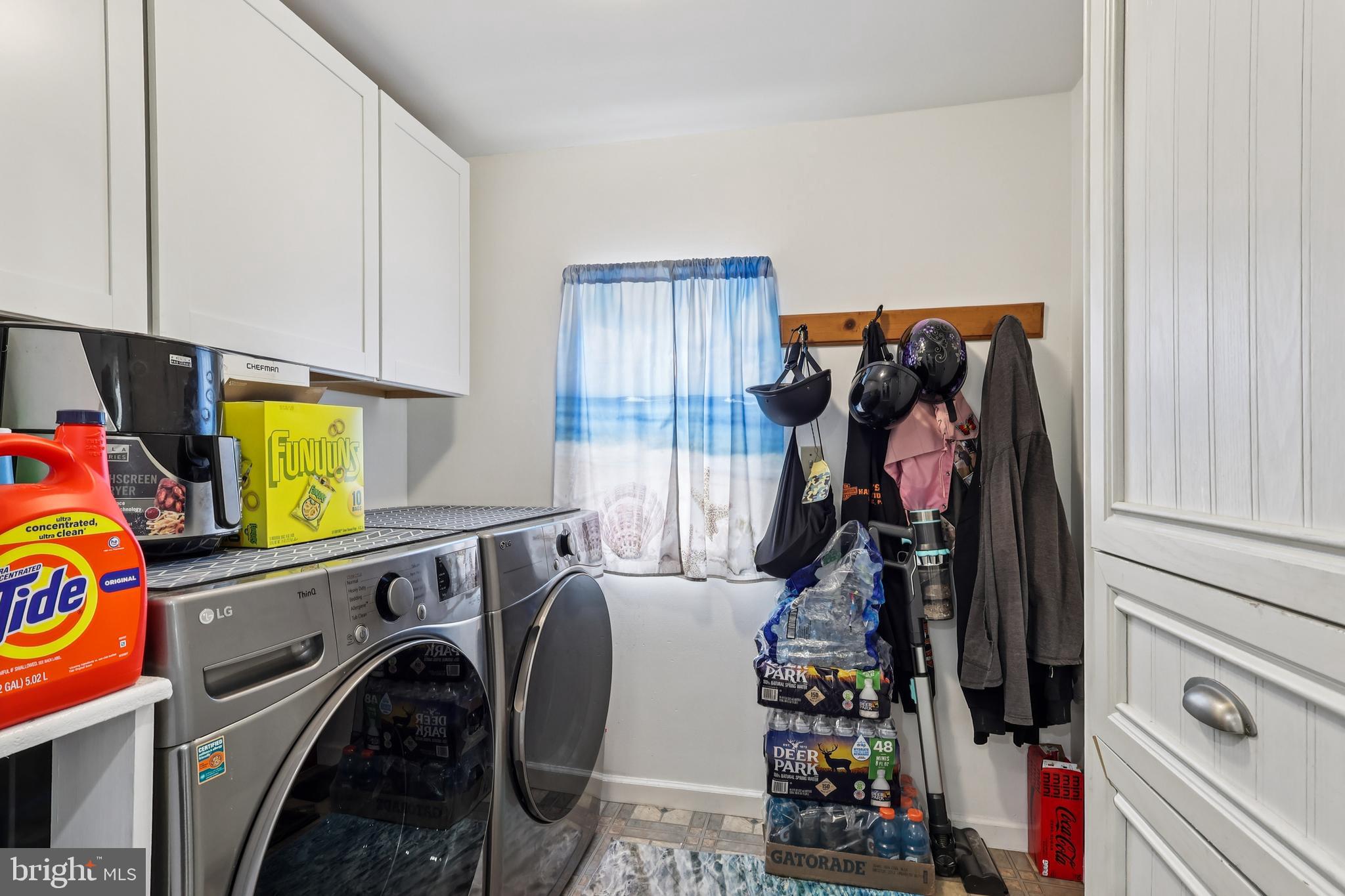 305 Filmore Street Riverside, NJ 08075 - Photo 15 of 32 a view of walk in closet with clothes and shoes