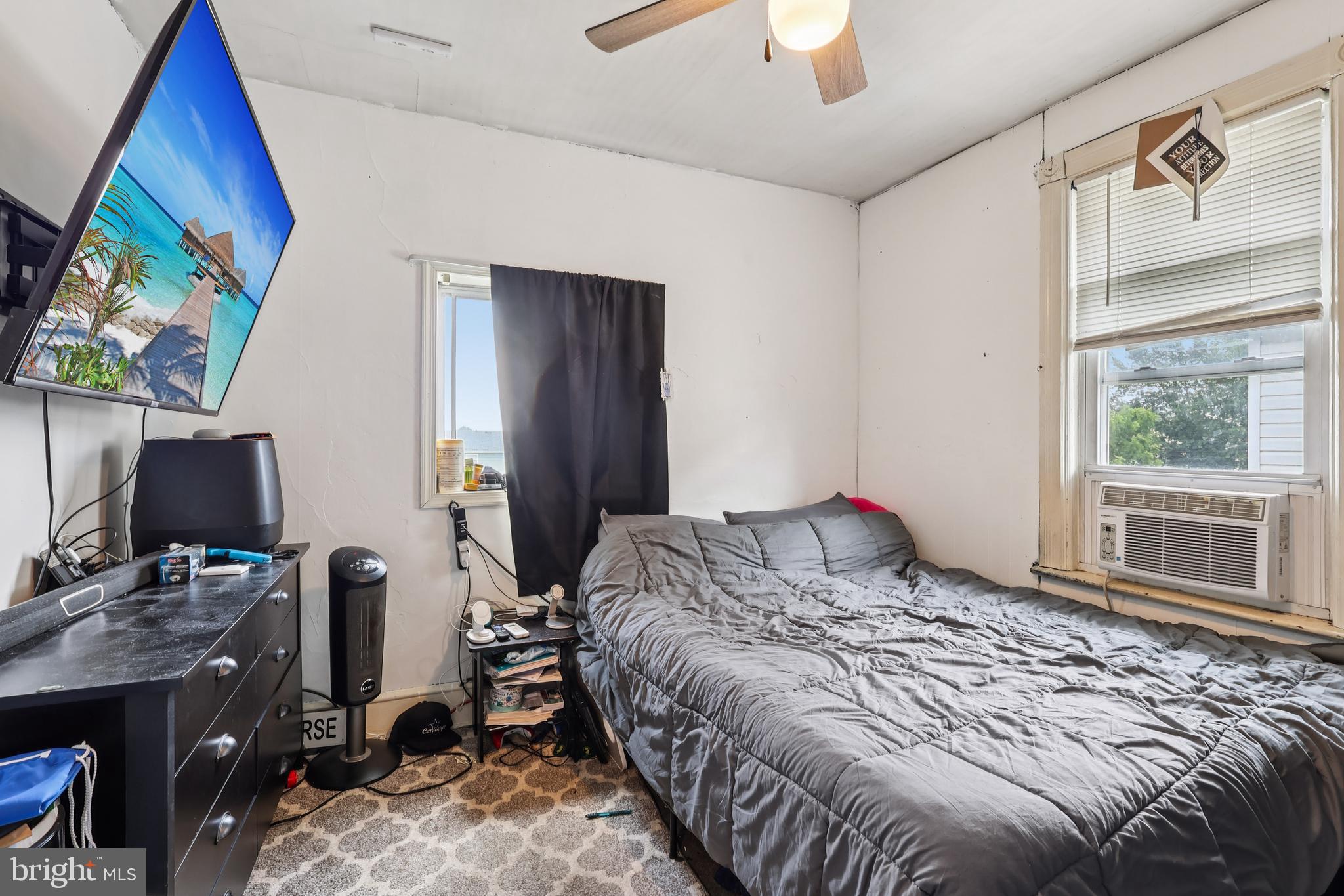 305 Filmore Street Riverside, NJ 08075 - Photo 18 of 32 a bedroom with a bed and a flat screen tv