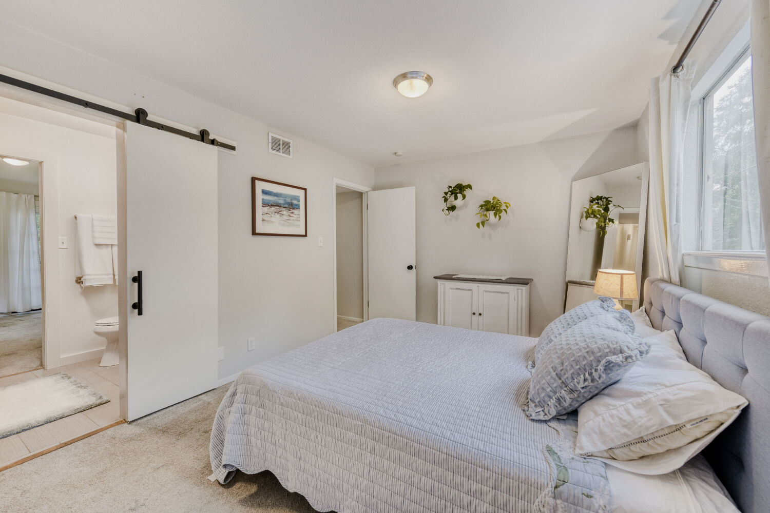 1912 Lightsey Road, Unit 6 Austin, TX 78704 - Photo 16 of 27 a bedroom with a large bed and a window