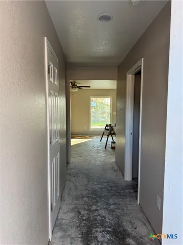 a bathroom with a tub and mirror