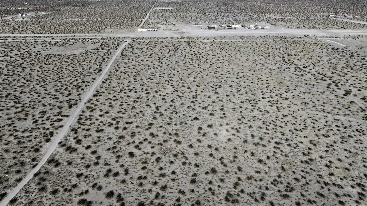 179937 Johnson Road Phelan, CA 92371 - Photo 3 of 16 a bathroom with a toilet and a shower curtain