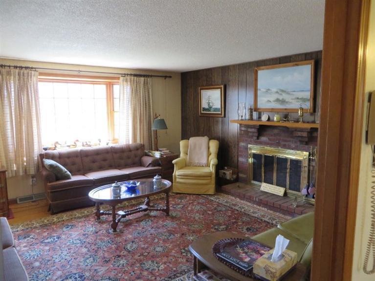 102 Suomi Road Hyannis, MA 02601 - Photo 8 of 19 a living room with furniture and a fireplace