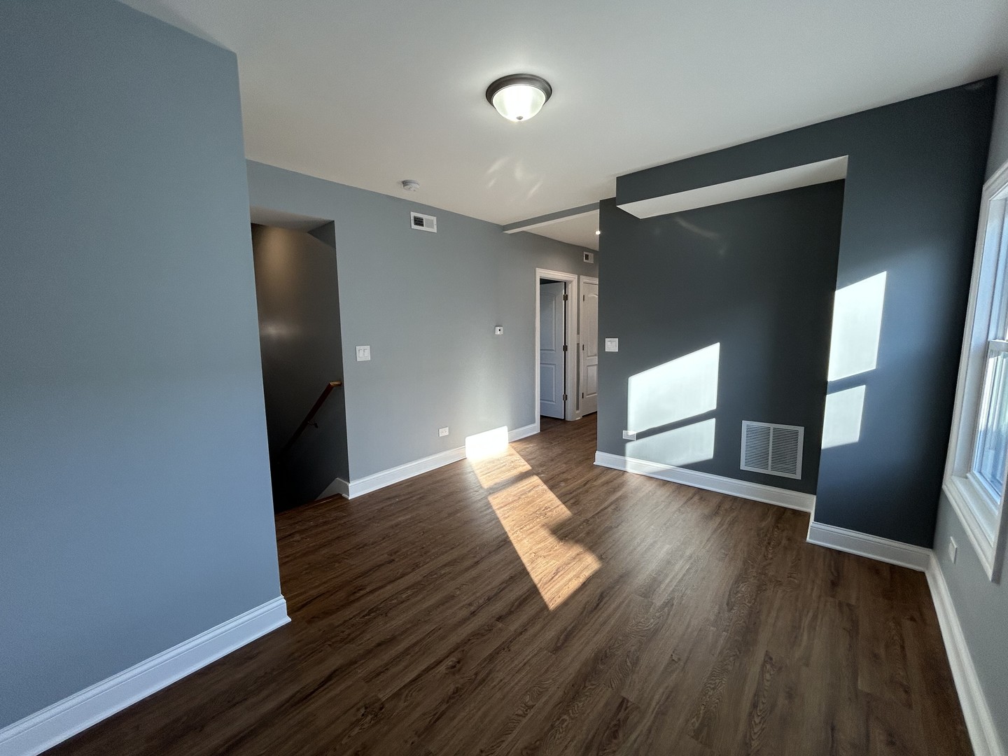 2717 North Rutherford Avenue, Unit 2 Chicago, IL 60707 - Photo 5 of 10 a view of empty room with wooden floor