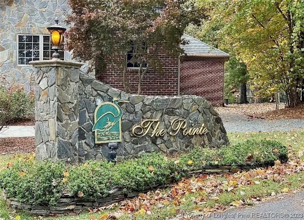 16 The Pointe Sanford, NC 27332 - Photo 2 of 4 a sign that is on the side of a road