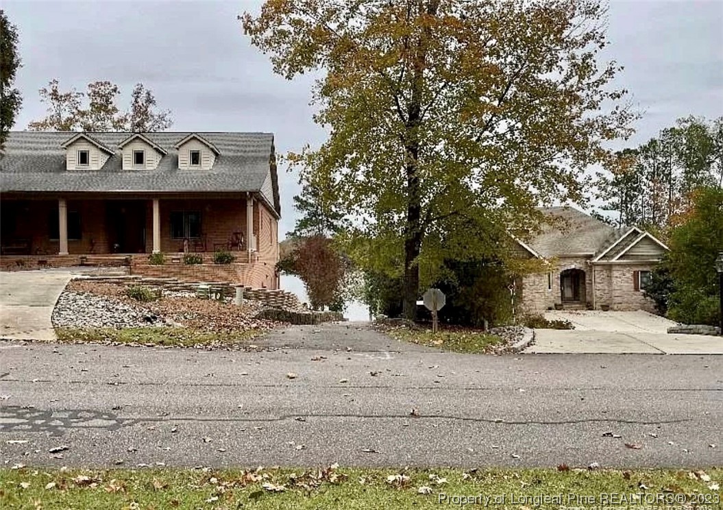 16 The Pointe Sanford, NC 27332 - Photo 4 of 4 a front view of a house with a yard