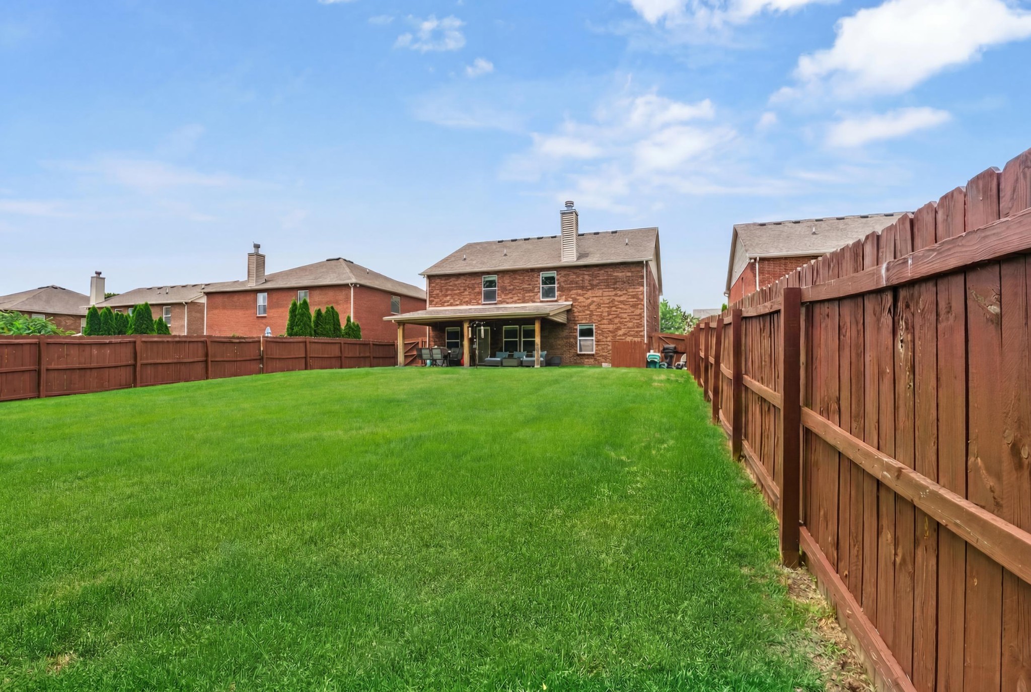 1011 Benwick Road Hendersonville, TN 37075 - Photo 48 of 60 a view of a house with a big yard and potted plants