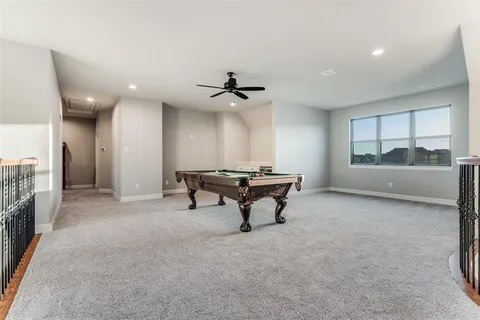 a view of a livingroom with furniture and a ceiling fan