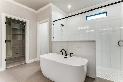 a bathroom with a bathtub and a sink