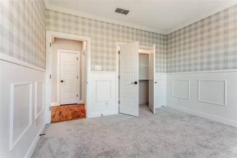 wooden floor and closet in a bathroom