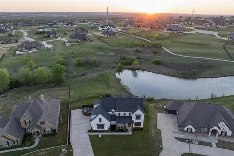 an aerial view of a house with a garden