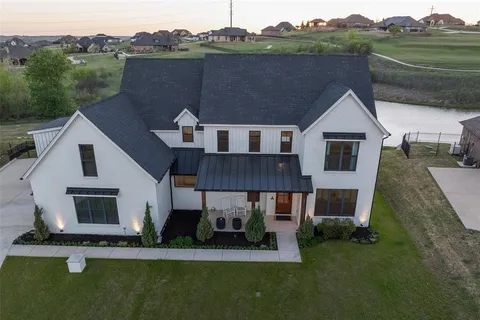 a aerial view of a house with a swimming pool