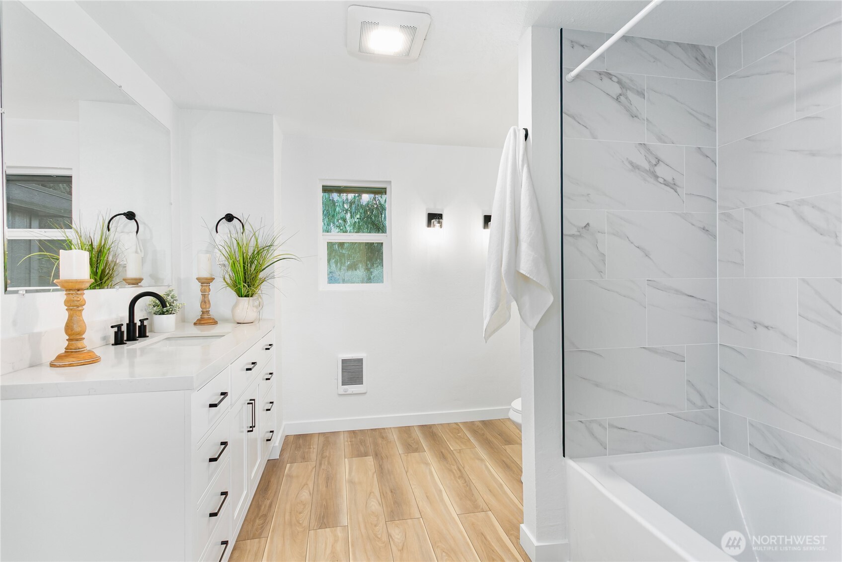 8021 Northeast Eglon Road Kingston, WA 98346 - Photo 16 of 35 a bathroom with a bathtub sink and mirror