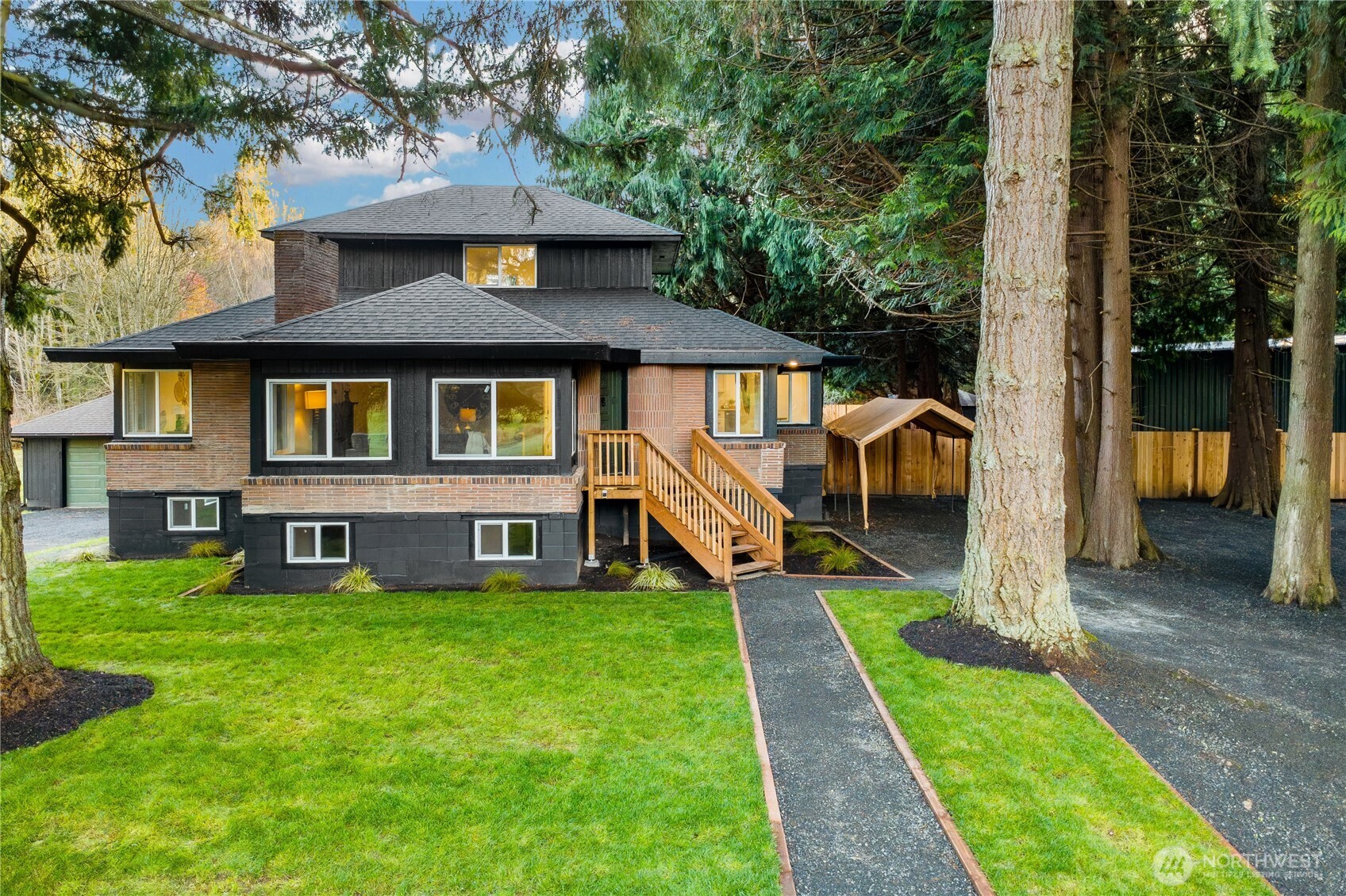 8021 Northeast Eglon Road Kingston, WA 98346 - Photo 2 of 35 a front view of a house with garden
