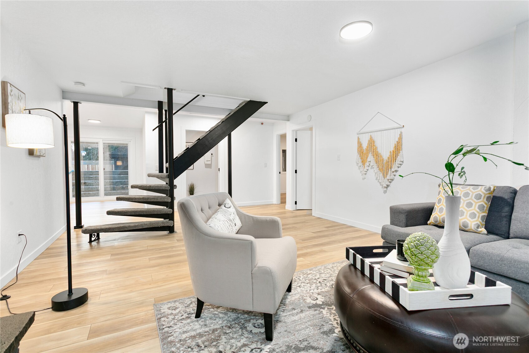 8021 Northeast Eglon Road Kingston, WA 98346 - Photo 24 of 35 a living room with couches and a potted plant on a coffee table