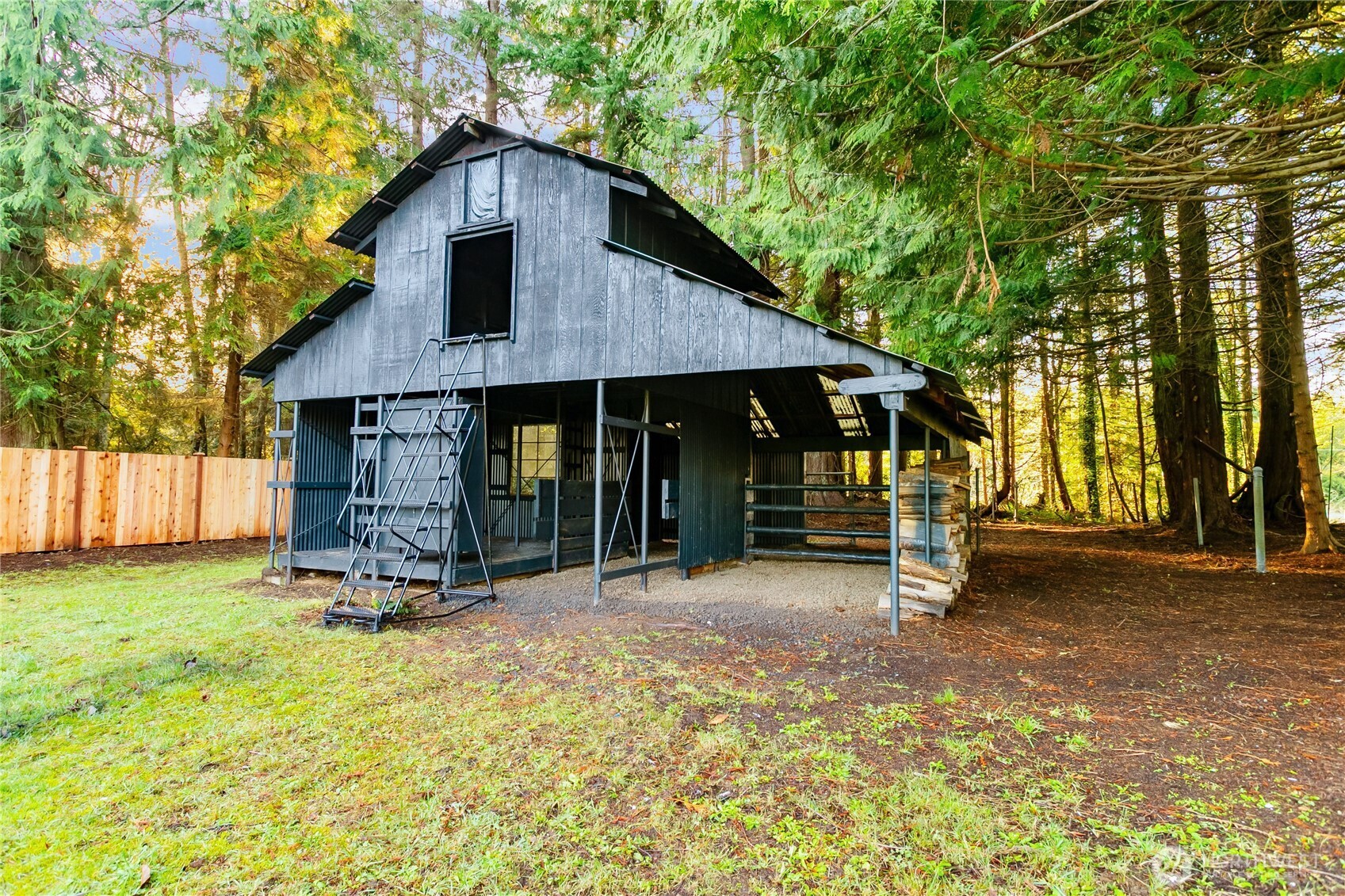 8021 Northeast Eglon Road Kingston, WA 98346 - Photo 33 of 35 a view of a house with backyard porch and garden