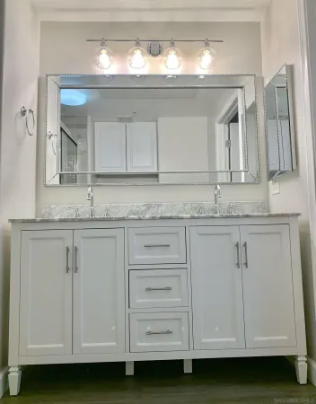 a bathroom with a sink and a mirror