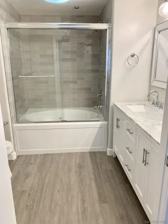a bathroom with a bathtub and a sink