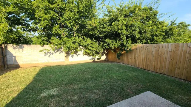 a view of backyard with green space