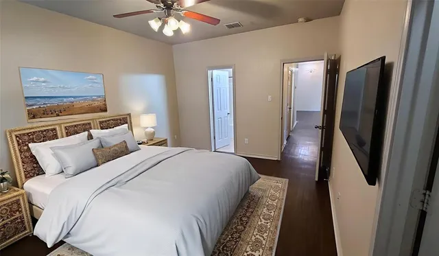 a bedroom with bed and a chandelier