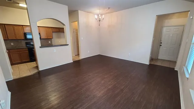 a view of a kitchen cabinets and wooden floor